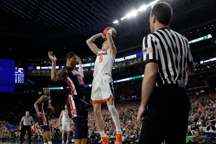 Samir Doughty got called for a foul on Virginia's Kyle Guy late during Saturday's game.