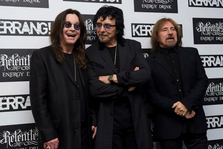 Ozzy Osbourne, Tony Iommi and Geezer Butler of Black Sabbath arrive for the Kerrang Awards 2012, at a central London venue. Thursday, June 7, 2012. (AP Photo/Jonathan Short)