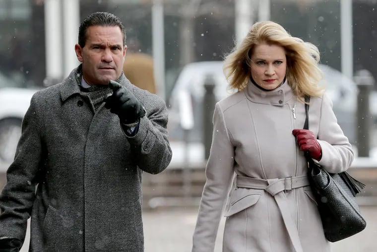 Marita Crawford, former political director for Local 98 of the International Brotherhood of Electrical Workers, arrives at the federal courthouse in Center City with her lawyer, Fortunato Perri Jr., in February 2019, after she was charged alongside several union officials in an embezzlement case.