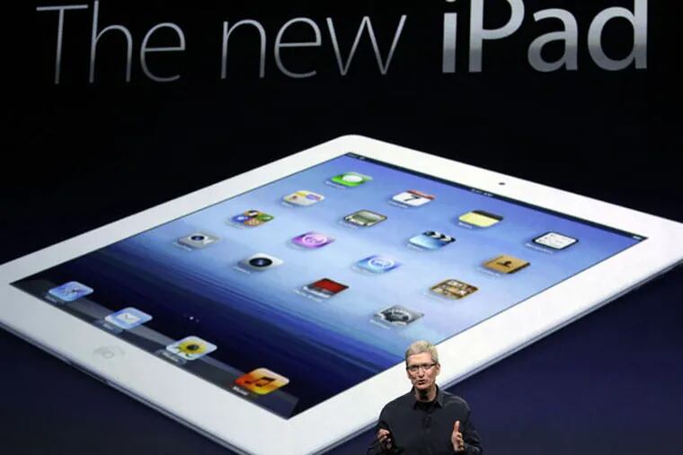 Apple CEO Tim Cook introduces the new iPad during an event in San Francisco, Wednesday, March 7, 2012.  The new iPad features a sharper screen and a faster processor.  Apple says the new display will be even sharper than the high-definition television set in the living room. (AP Photo/Paul Sakuma)