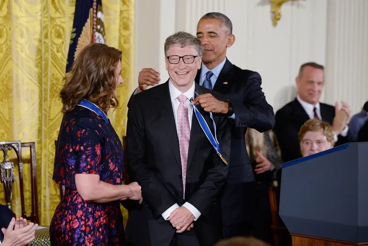 U.S. President Barack Obama presents Bill and Melinda Gates with the Presidential Medal of Freedom, the nation's highest civilian honor, during a ceremony on Tuesday, Nov. 22, 2016 honoring 21 recipients in the East Room of the White House in Washington, D.C.