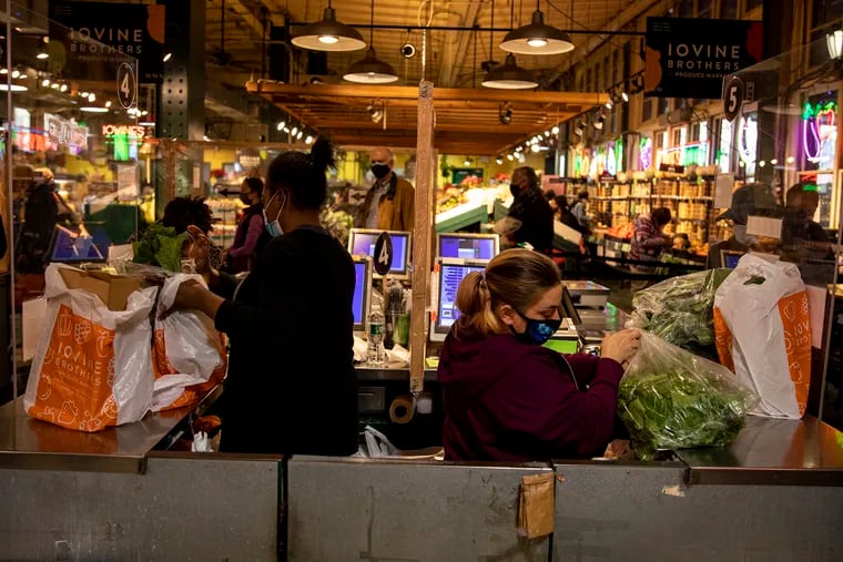 People are making last minute trips gathering ingredients for Thanksgiving at Reading Terminal Market on Wednesday, Nov. 25, 2020.