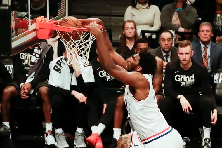 Sixers center Joel Embiid dunks the basketball during the fourth quarter against the Brooklyn Nets in Game Four of their Eastern Conference opening-round series on Saturday in Brooklyn.