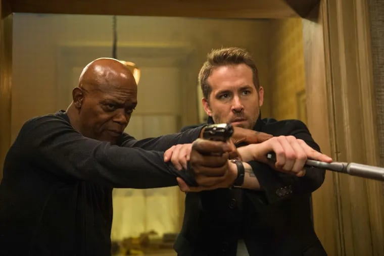 Samuel L Jackson as the unpredictable assassin and Ryan Reynolds (right) as the security pro in the comedy-action flick “Hitman’s Bodyguard.”