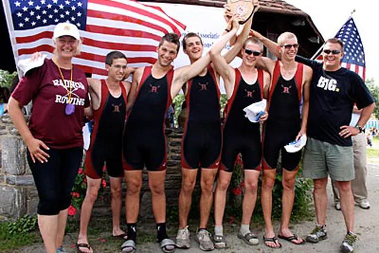 Radnor rowers and coaches hoist the championship plaque after they won the varsity four with coxswain at the Scholastic Rowing Association of America’s national championships on the Cooper River in Pennsauken, N.J. From left  are coach Valeria Gospodinov, Ben Croop, Jimmy Puckette, Cameron Staines, Declan Carbery, JP Aftring, and rowing director Ken Piree