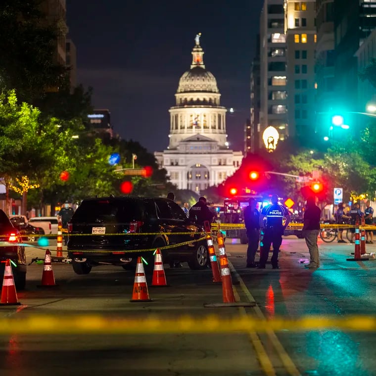 Police investigate a homicide shooting that occurred at a demonstration against police violence in downtown Austin, Texas, July 25, 2020.