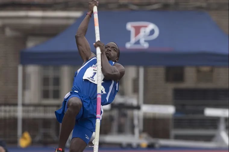 Ken Mullings, a sophomore at the University of the Bahamas, competes in the pole vault event during the college men’s decathlon at the Penn Relays on Wednesday.
