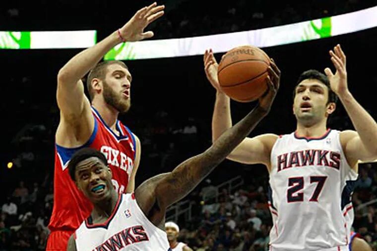 Spencer Hawes, who missed 11 games due to injury, returned to the Sixers lineup on Saturday night. (John Bazemore/AP)