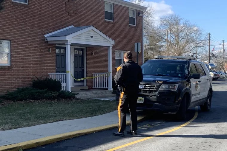 Evesham Township police investigate what they are calling a "suspicious death" of a man at the Olympus Apartments on Baker Boulevard on Saturday. A "person of interest" is in custody, authorities said.