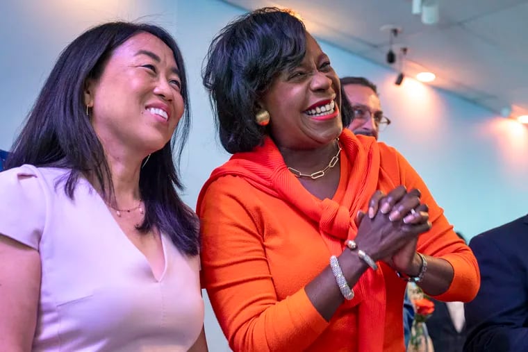 Mayor Cherelle L. Parker (right) stands with Democratic primary rival Helen Gym during a “unity breakfast" last year after Parker captured the nomination.