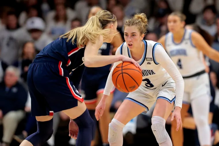 Villanova's Lucy Olsen guards Paige Bueckers during the second half on Wednesday. Bueckers, one of women's college basketball's marquee names, is projected as a top-three pick in April's WNBA draft. Could Olsen join her in the pros next year?