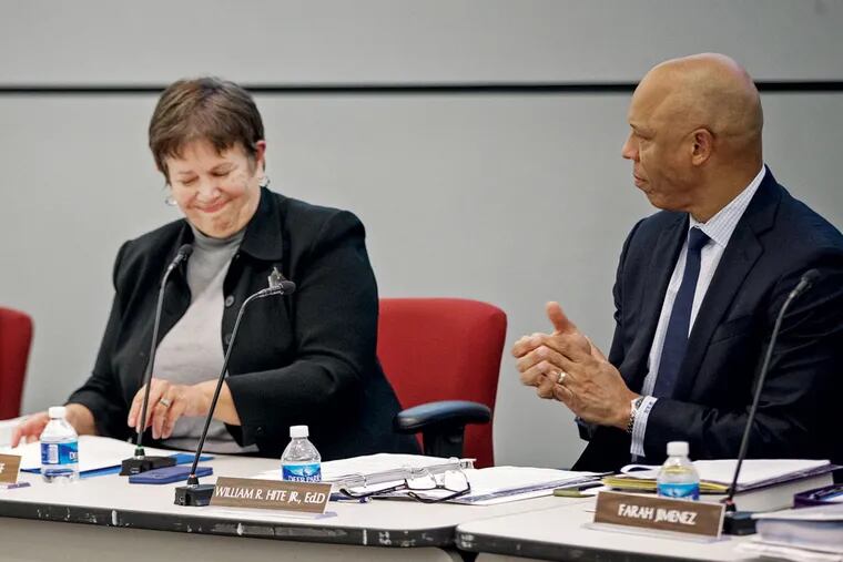 At her last SRC meeting as chair, Marjorie Neff, a former district teacher and principal, receives applause from Superintendent William R. Hite Jr.