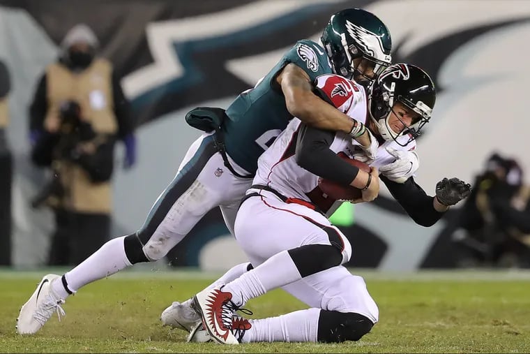 The EaglesÕ Rodney McLeod, left, sacking Falcons QB Matt Ryan during the teams' playoff matchup in January.