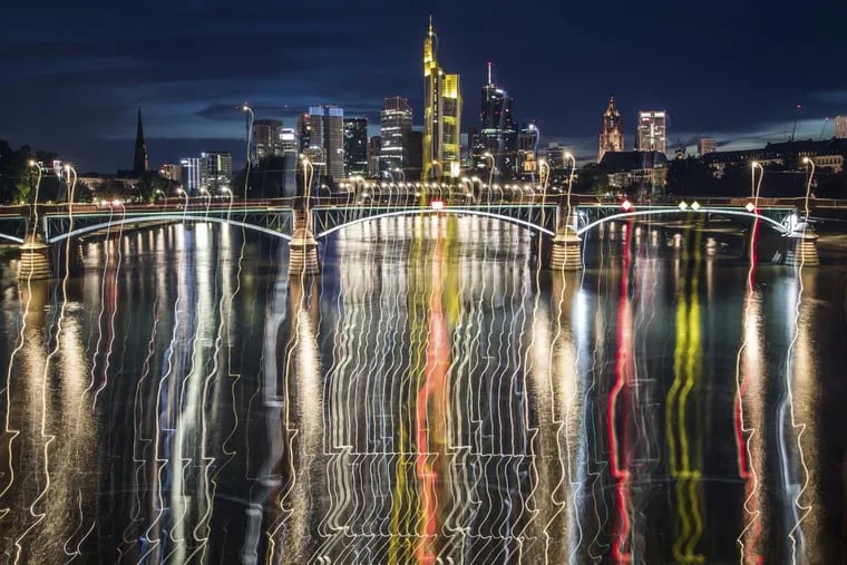 The Frankfurt skyline on July 30, reflected in the river Main behind the Ignatz-Bubis bridge.