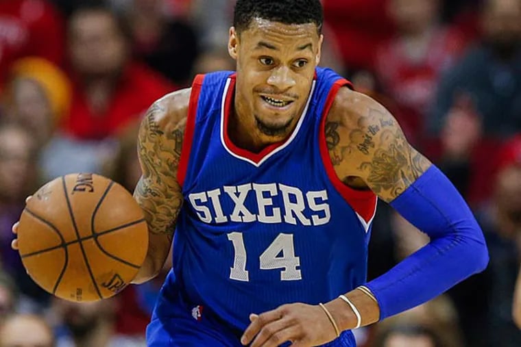 Philadelphia 76ers guard K.J. McDaniels (14) brings the ball up the court during the fourth quarter against the Houston Rockets at Toyota Center. The Rockets defeated the 76ers 88-87. (Troy Taormina/USA Today)