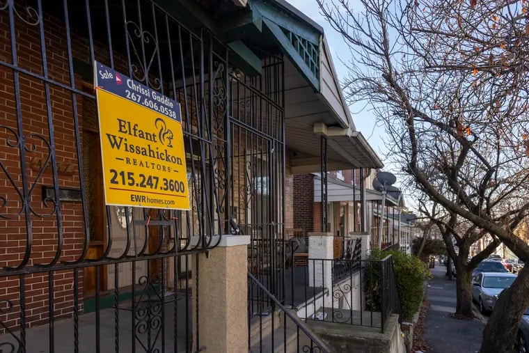 A sign advertises a home for sale at 4257 Penn St. in Philadelphia in December. In the Philadelphia area and the country as a whole, record low housing supply is a challenge for buyers.
