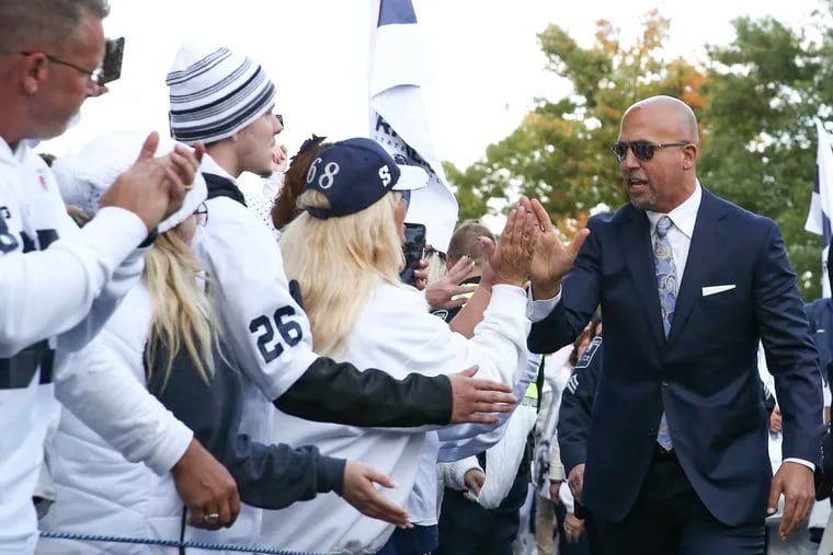 Penn State head coach James Franklin greets fans after his team entered Beaver Stadium for its White Out game against Michigan on Saturday.