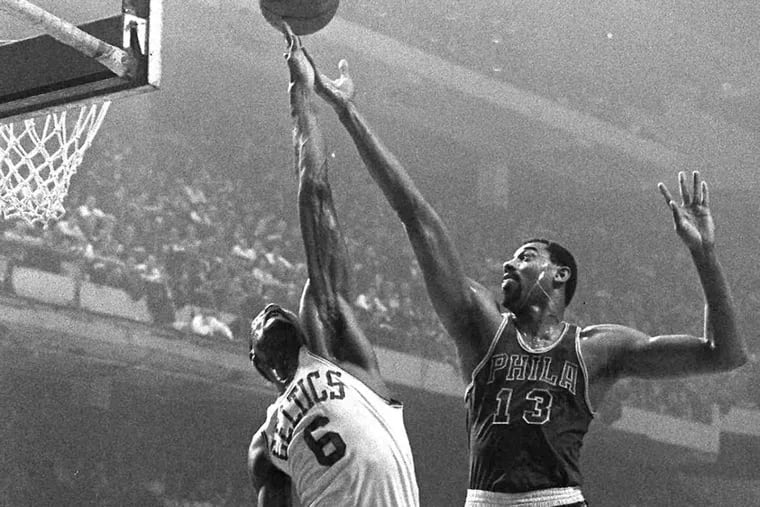 Boston’s Bill Russell (6) outreaches Wilt Chamberlain to control a rebound in Boston in this Jan. 15, 1967 photo.