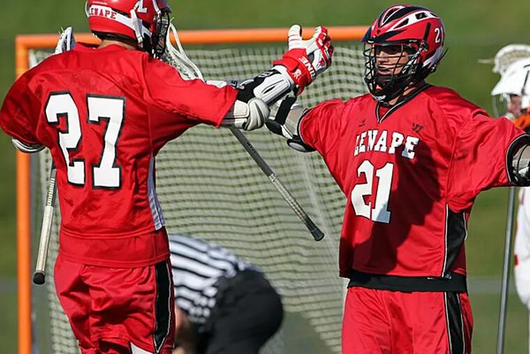 Lenape High's Reed Hofmann (center) celebrates his second period goal
with teammates Brandon Sweder (left) and Connor Wolfe against Cherokee
High on Tuesday, May 21, 2013.  (Yong Kim/Staff Photographer)