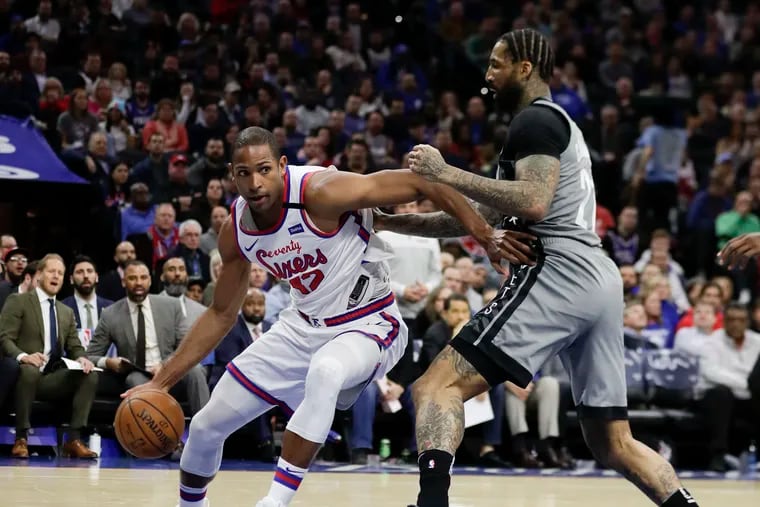Sixers forward Al Horford dribbles the basketball against Brooklyn Nets forward Wilson Chandler on Thursday, February 20, 2020 in Philadelphia.