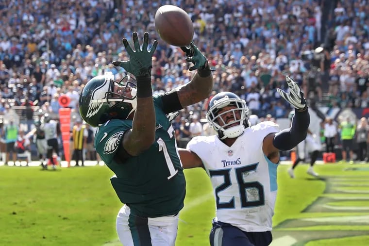 Eagle wide receiverAlshon Jeffery, left, could not come down with the catch in the end zone against Titan cornerback Logan Ryan, right, in the fourth quater that would have won the game in regulation time. The Eagles had to settle for a tying field goal. Eagles lost to the Tennessee Titans at Nashville on Sunday September 30, 2018, 26-23. MICHAEL BRYANT / Staff Photographer
