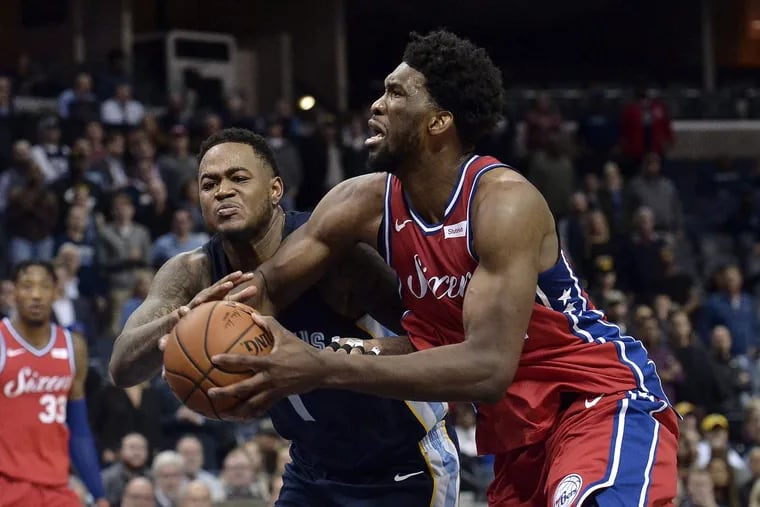 Joel Embiid drives against Memphis Grizzlies forward Jarell Martin in the second half. Embiid had a rough night.
