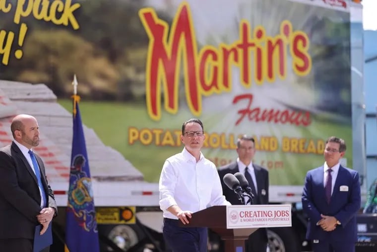 Gov. Josh Shapiro speaks at a news conference in Chambersburg on Tuesday to announce the expansion of Martin's Potato Rolls in the area. The Martin family was a top supporter of Doug Mastriano, Shapiro's Republican opponent in the 2022 governor's race.