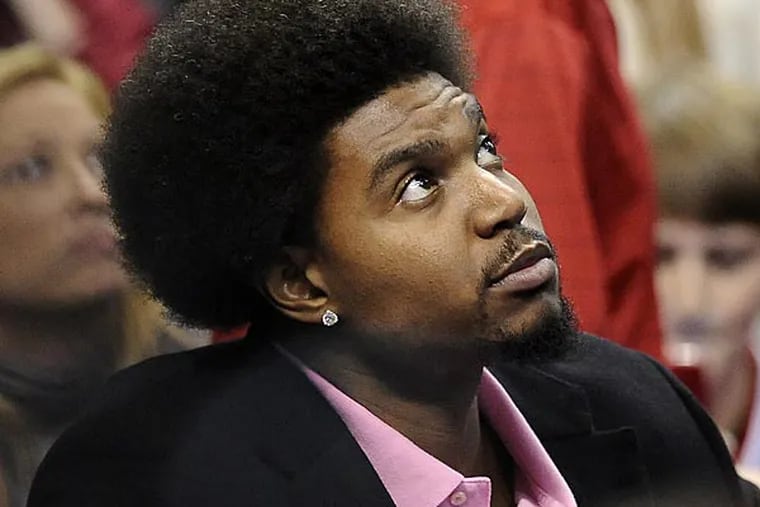 76ers Andrew Bynum is seen on the bench during the second half of an NBA basketball game, Sunday, Nov. 18, 2012, in Philadelphia. The 76ers won, 86-79. (AP Photo/Michael Perez)