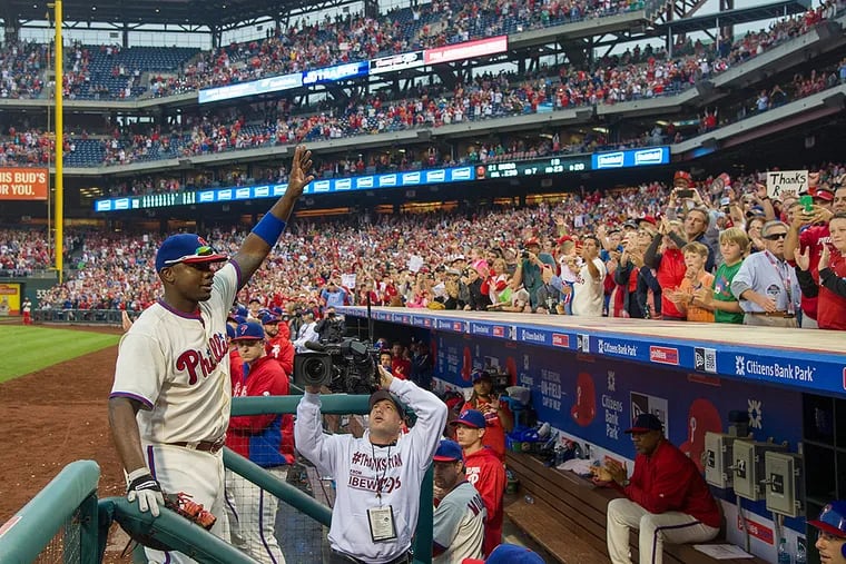 Ryan Howard acknowledges the standing ovation from the fans as he is taken out in the 9th inning of his last game as a member of the Phillies.