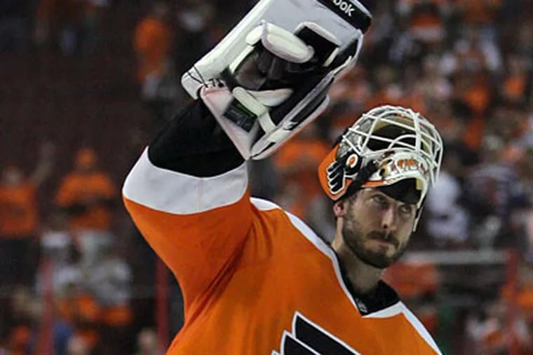 Michael Leighton celebrates the Flyers 6-0 Game 1 victory against the Canadiens. (Yong Kim / Staff Photographer)