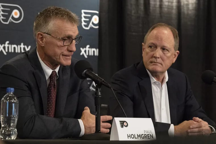 Flyers president Paul Holmgren (left) and Comcast Spectacor CEO Dave Scott discuss why they fired general manager Ron Hextall.