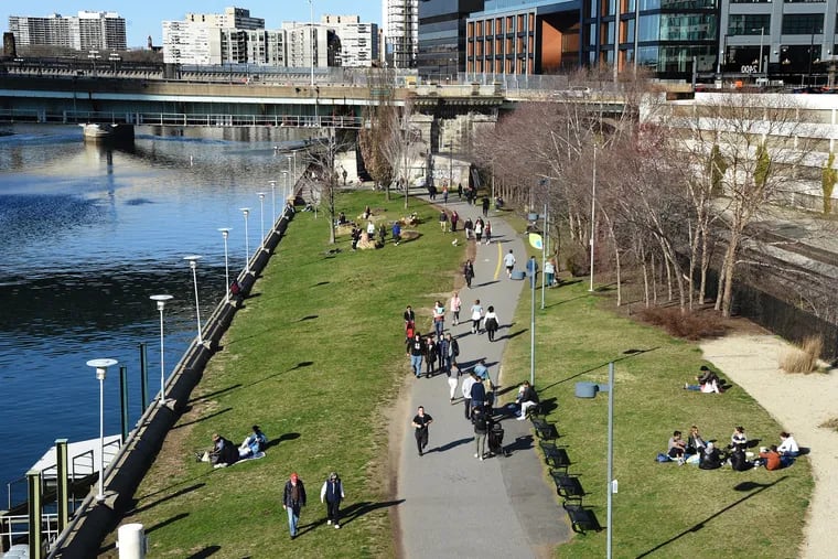 Despite the commands for social distancing, people are flowing to the Schuylkill River Trail.