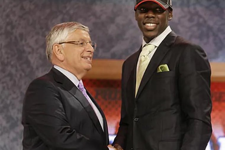 NBA commissioner David Stern congratulates Jrue Holiday after the 76ers drafted the UCLA guard. (Seth Wenig/AP)