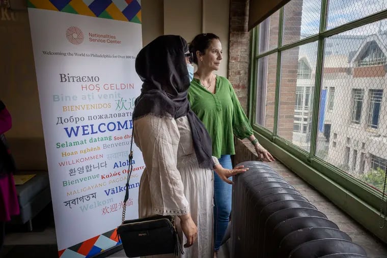 Gwen Soffer, the manager of wellness at Nationalities Service Center in Philadelphia, stands with an Afghan refugee in October, 2022. Increasing language diversity in the mental health field has been a top priority for Soffer. (Alejandro A. Alvarez/The Philadelphia Inquirer/TNS)