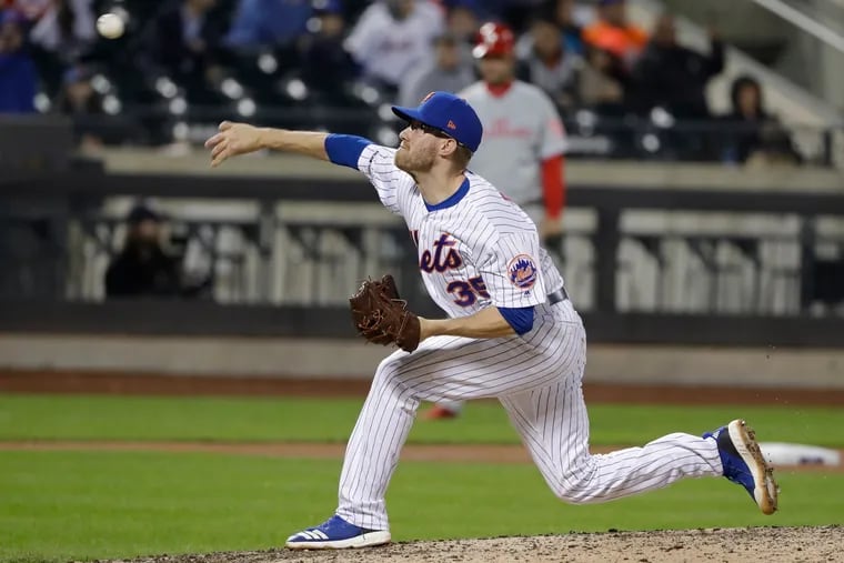 Mets reliever Jacob Rhame threw two pitches toward Rhys Hoskins' head Tuesday night but denied any intent.