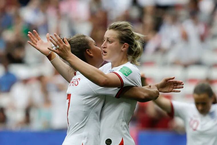 England's Ellen White, right, celebrates with England's Nikita Parris after scoring her side's second goal during the Women's World Cup Group D soccer match between England and Scotland in Nice, France, Sunday, June 9, 2019. (AP Photo/Claude Paris)