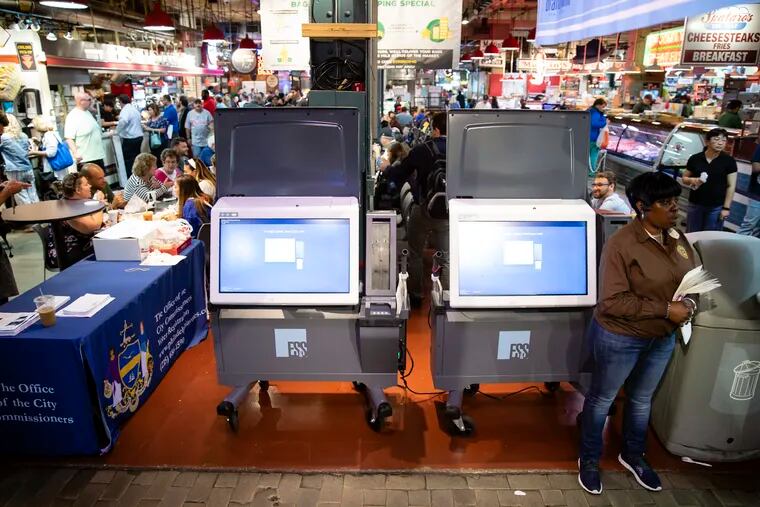 FILE - In this June 13, 2019, file photo, ExpressVote XL voting machines are displayed during a demonstration at the Reading Terminal Market in Philadelphia. More than one in ten voters could vote on paperless voting machines in the 2020 general election, according to a new analysis, leaving their ballots vulnerable to hacking according to a new study. (AP Photo/Matt Rourke, File)