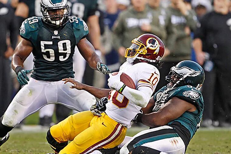 The Eagles' Fletcher Cox and DeMeco Ryans. (Ron Cortes/Staff Photographer)