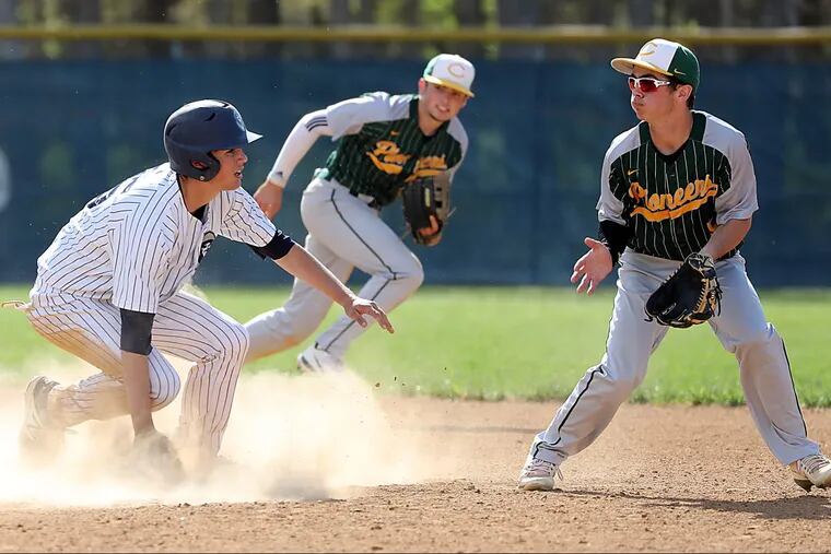 St. Augustine’s Nick Lonetto slides into second base past Clearview second baseman Erick Weiss on Tuesday.