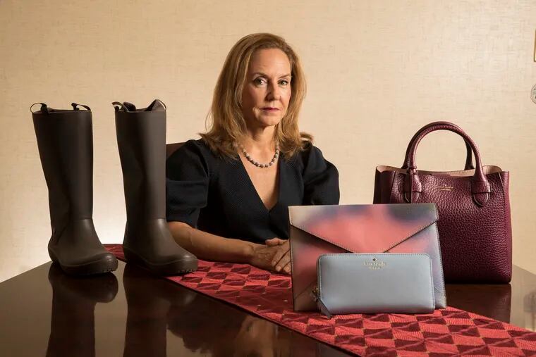 Karen Giberson, President of The Accessories Council is leading the war against the Trump Administration's tariffs as they promise to adversely effect fashion accessories, especially handbags. She is shown with a selection of items on July 25, 2018. CHARLES FOX / Staff Photographer
