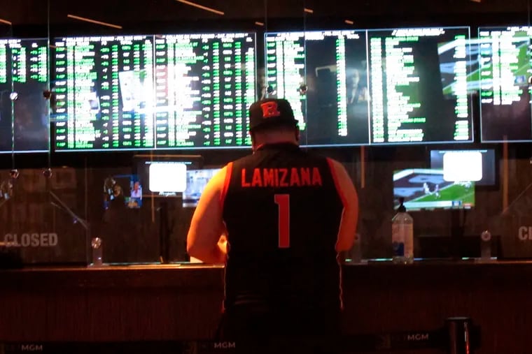 A bettor places a wager at the Borgata casino in Atlantic City on Friday, March 19, 2021, the first full day of the NCAA March Madness tournament.