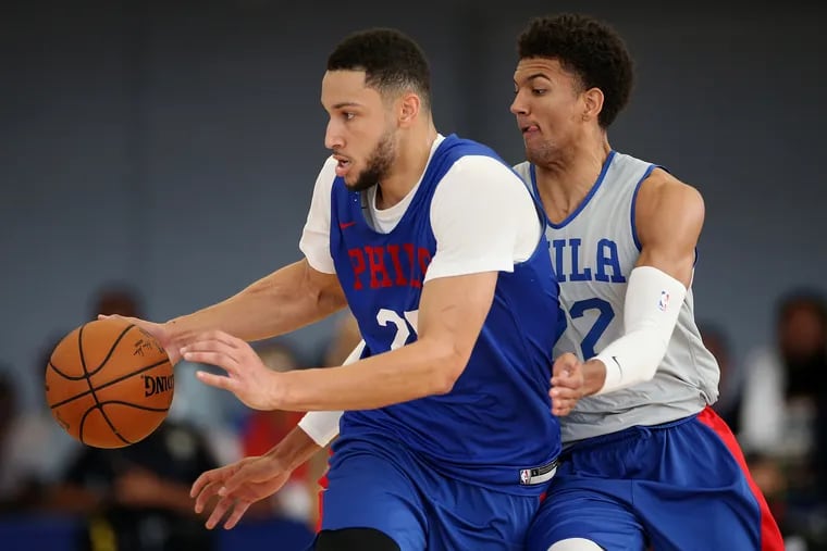 Sixers guard/forward Ben Simmons (25) tries to fend off guard Matisse Thybulle (22) during the Sixers' annual Blue and White Scrimmage on Saturday.