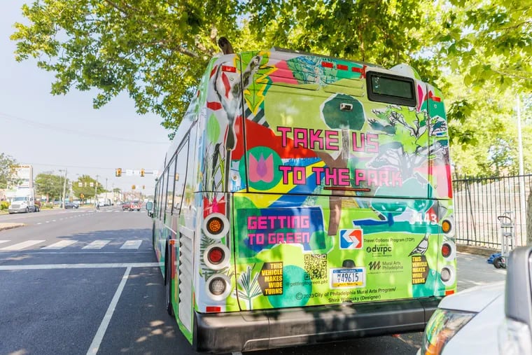 A SEPTA bus is parked at Fourth Street and Oregon Avenue during the unveiling of a new SEPTA Route 7 bus wrap as part of a collaboration between Mural Arts Philly and SEPTA to get people to use public transportation to get to the city's green spaces.