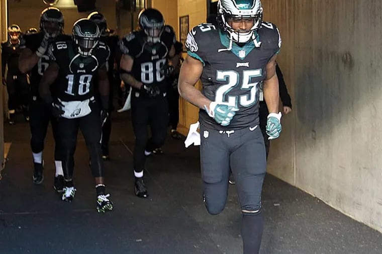 LeSean McCoy leads the offense on the field during pregame warm-ups. (Yong Kim/Staff Photographer)