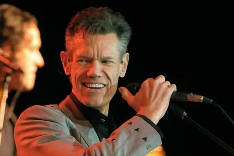 Randy Travis and ex-wife Elizabeth, who divorced in 2010 after 19 years of marriage, have filed suits against each other.

Associated Press