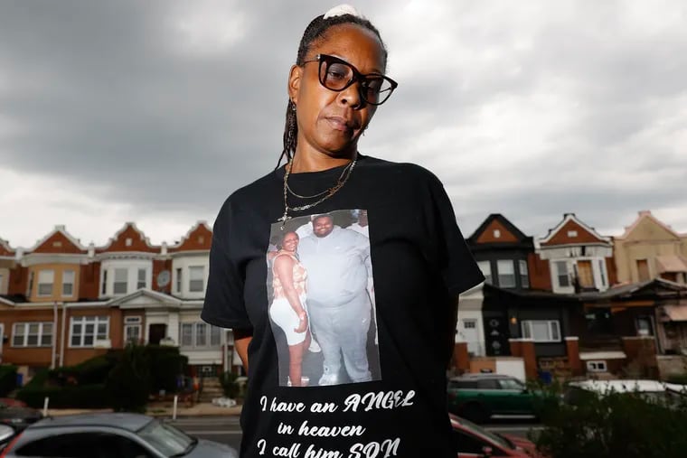 Terri Veracruz stands at her West Philadelphia home wearing a shirt with an image of her and her son on Thursday, April 6, 2023.  Veracruz's son, Terrell White, was killed on March 4, 2023. The morning after she buried her son, she saw an Allen Domb campaign television ad with the car her son had been driving.