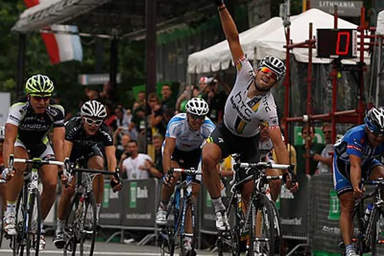 Alex Rasmussen celebrates after winning the TD Bank International Championship bike race. (David Maialetti/Staff Photographer)