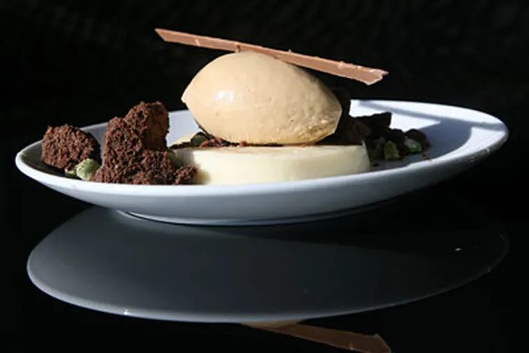 White miso panna cotta is served with soy ice cream; pastry chef Peter Scarola offers several dessert winners. (CHARLES FOX / Staff Photographer)