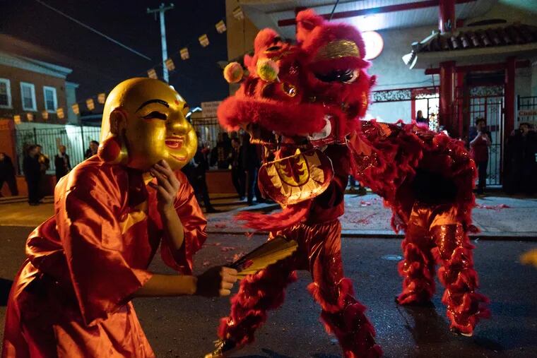 Traditional Lion Dance performers celebrate the Lunar New Year's Eve at Bo De Buddhist Temple, in Philadelphia, Feb. 4, 2019. JESSICA GRIFFIN / Staff Photographer