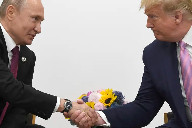 President Donald Trump, right, shakes hands with Russian President Vladimir Putin during a bilateral meeting on the sidelines of the G-20 summit in Osaka, Japan, Friday, June 28, 2019.